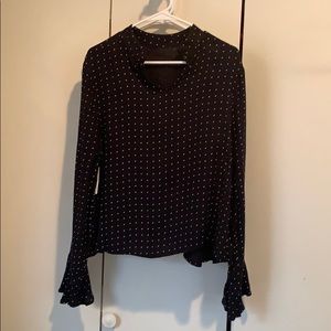 Black and white polkadot long sleeve shirt.